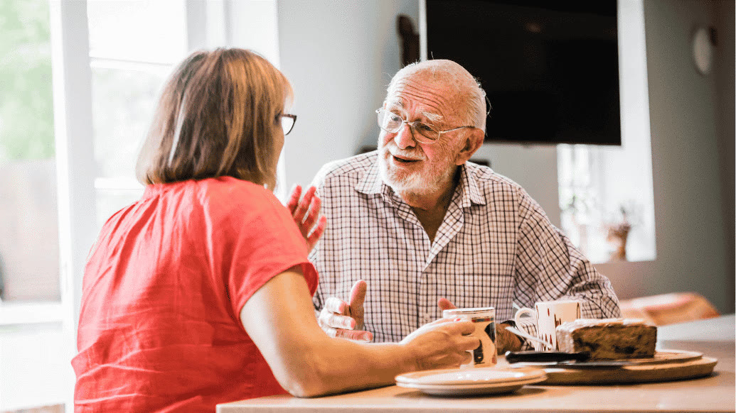 A professional live-in carer with a client at home