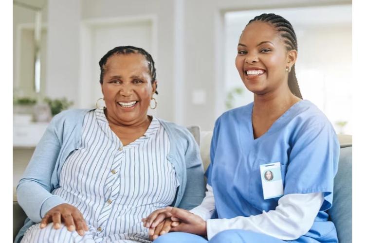 A live-in carer with the person she supports at home