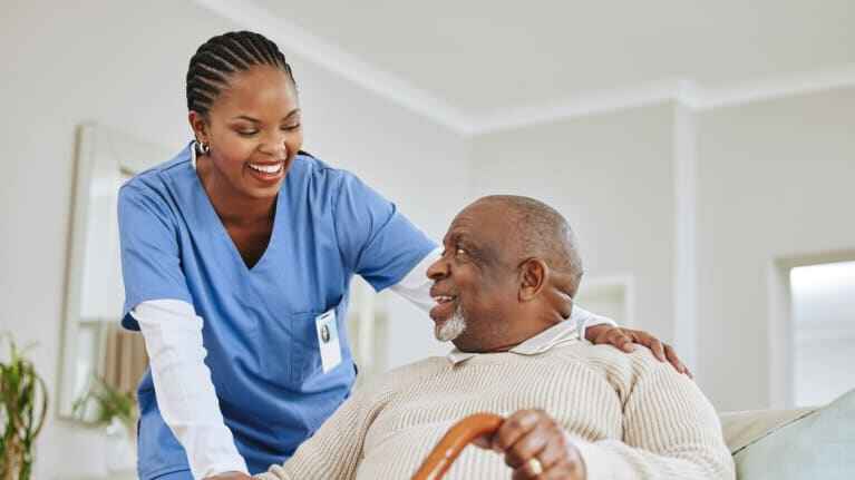 A live-in carer and client together at home