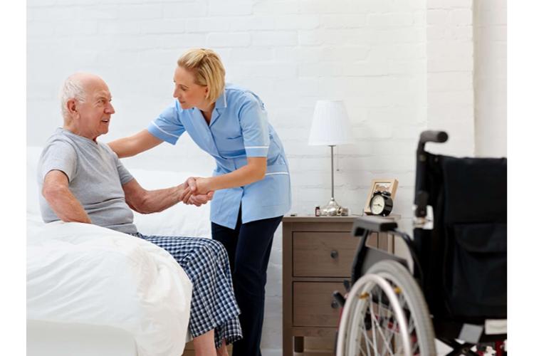 A carer supporting an elderly client at home