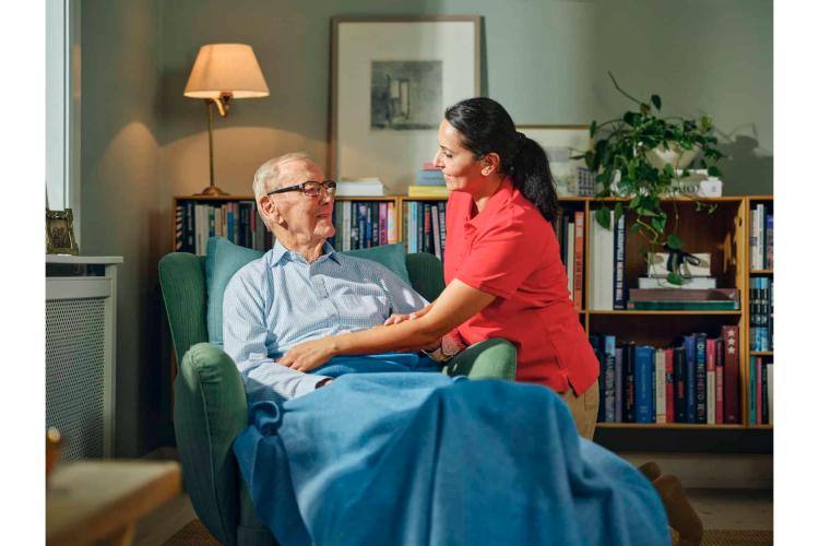 A carer supporting a client at home