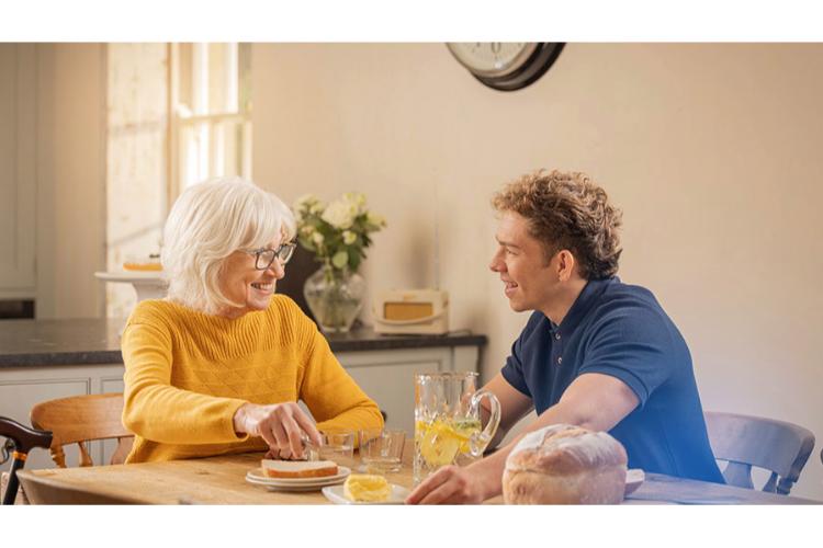 A live-in carer and client together at home