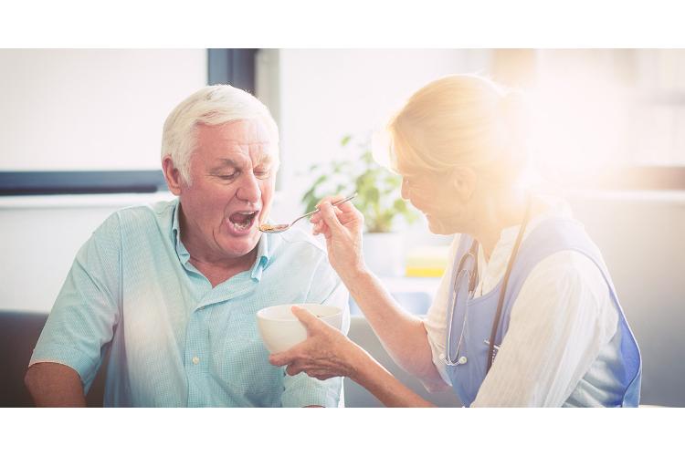 A live-in carer and client together at home