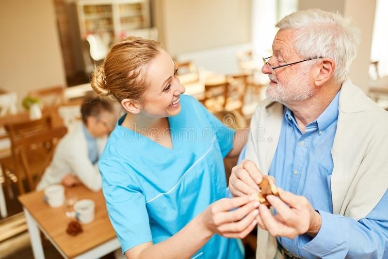 A live-in carer and client together at home