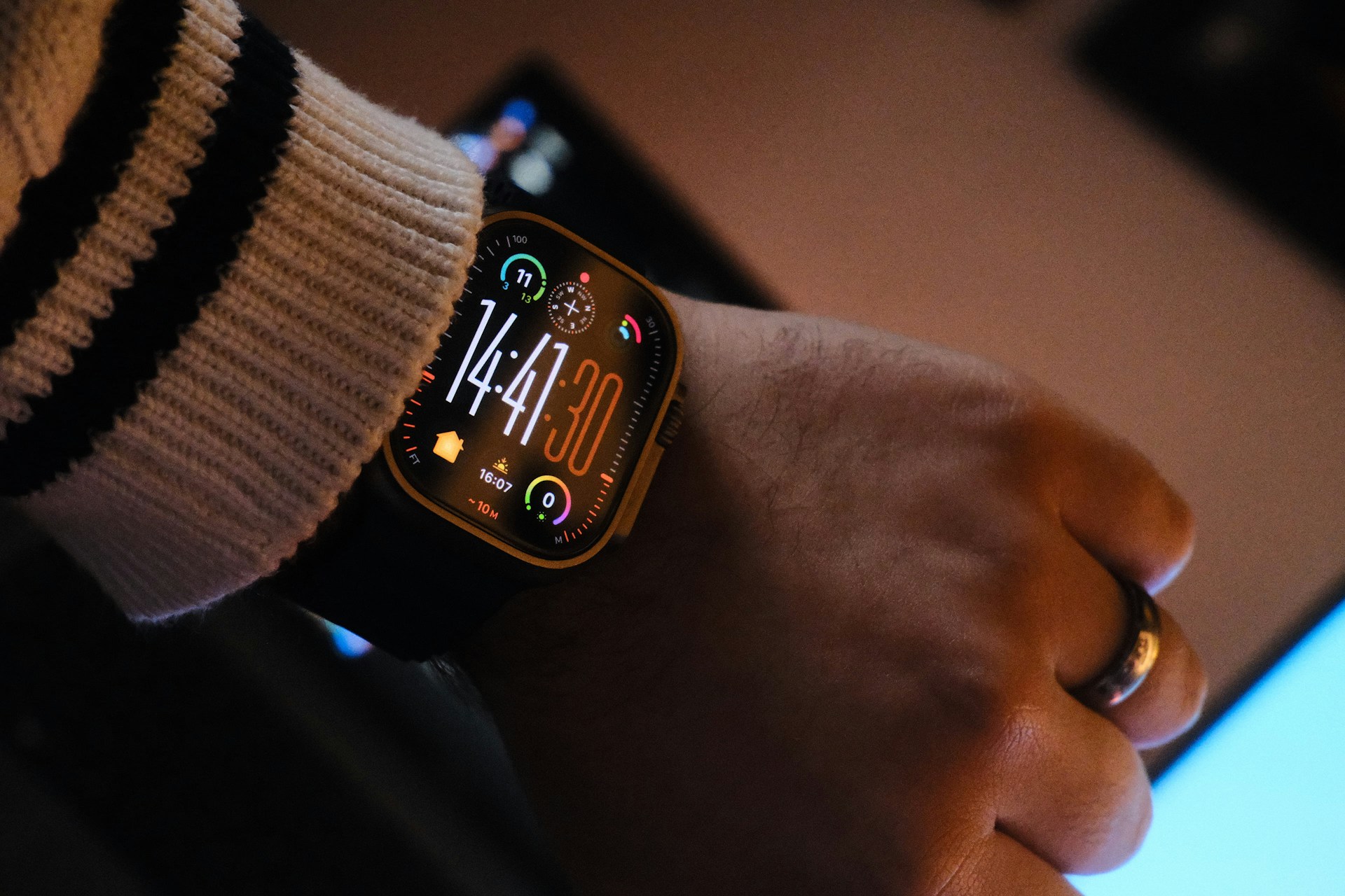 Close-up of a wearable health sensor used to monitor an older adult's vital signs