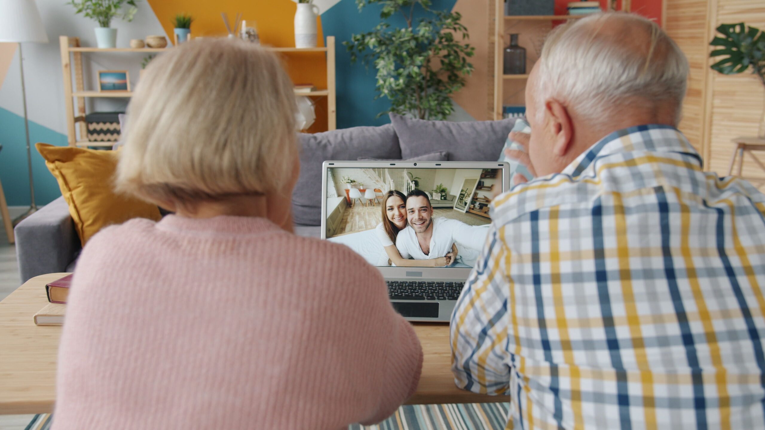 Family staying connected with an older relative supported by home care technology